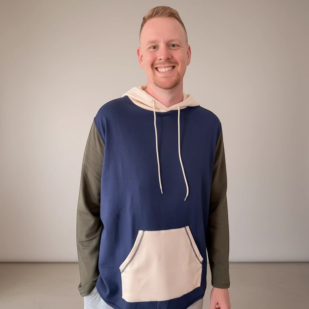 Comfort on the Spectrum Adult Sensory-Friendly Hoodie in navy, olive green, and cream. Bamboo-cotton blend with oversized hood and pouch pocket.