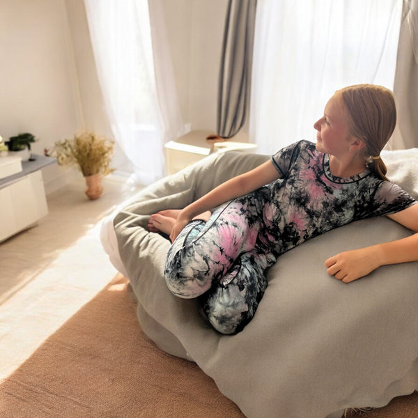 Peaceful indoor camping scene designed for sensory-friendly school holiday comfort with fairy lights and cozy tents.