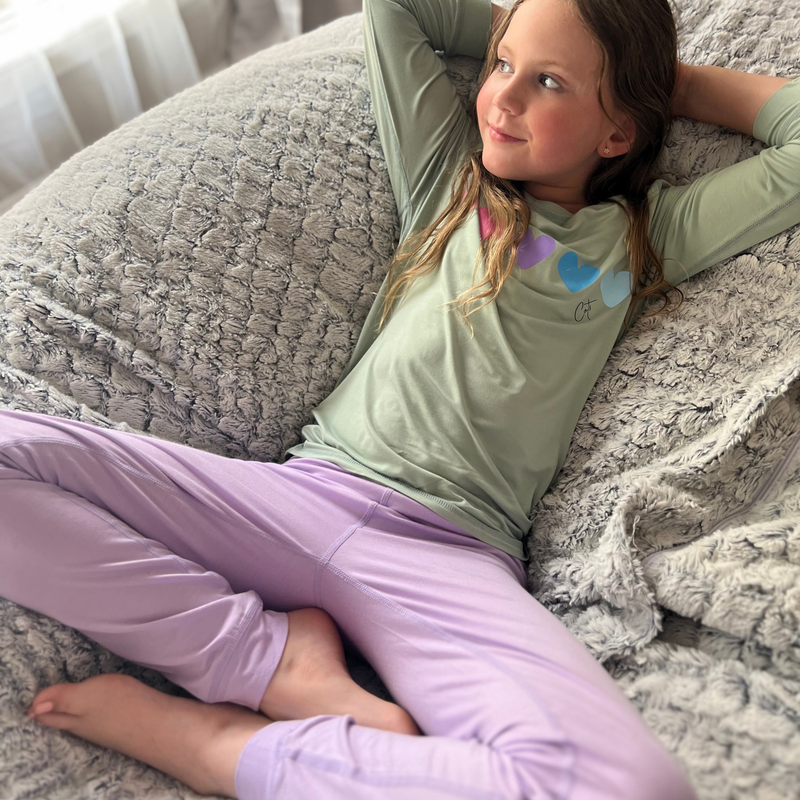 A girl wearing a Lavender Sweetheart  Long Set Pajamas for Teens & Kids