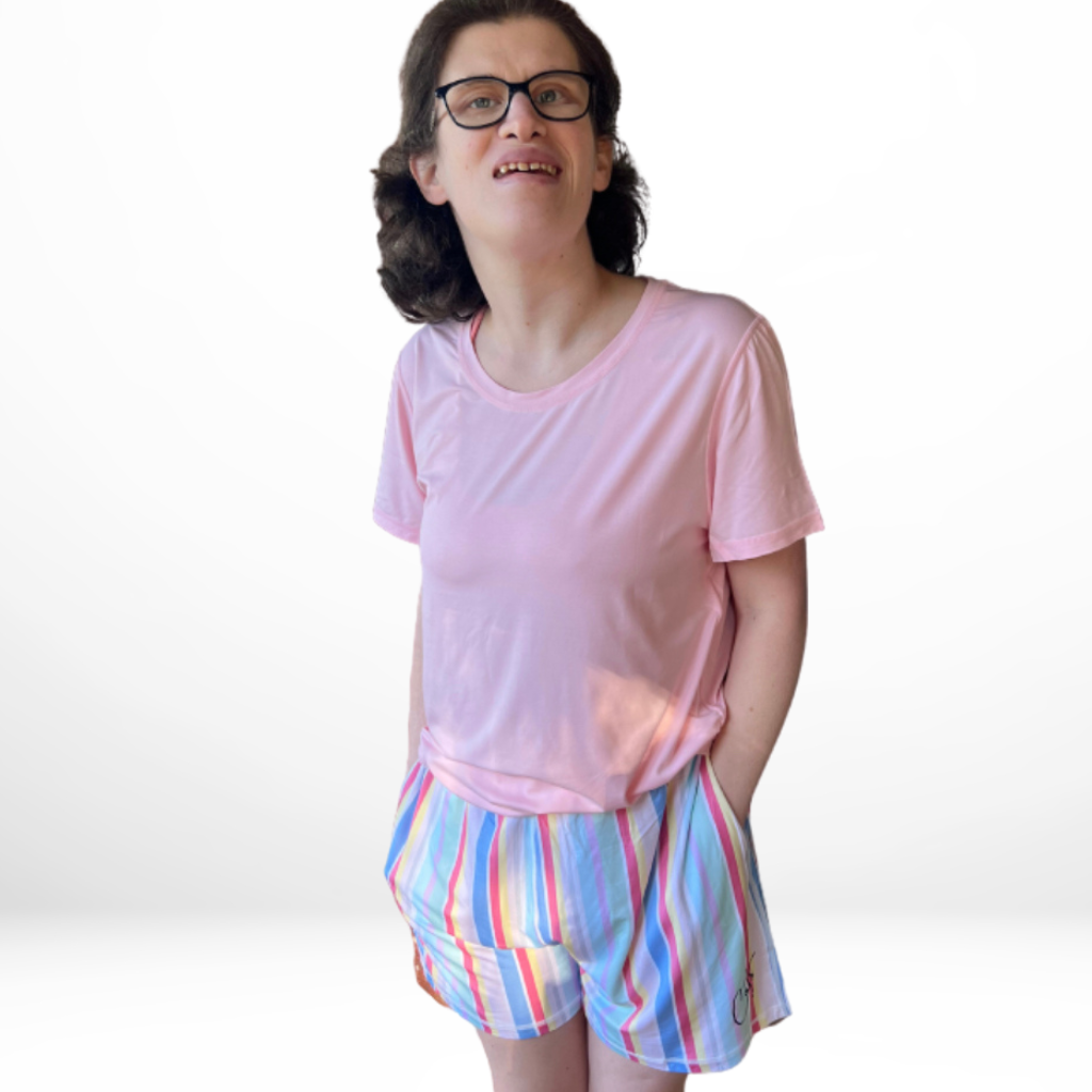 A leady wearing the adult sweet dreams shorts - the bamboo short pyjamas from Comfort on the Spectrum.
