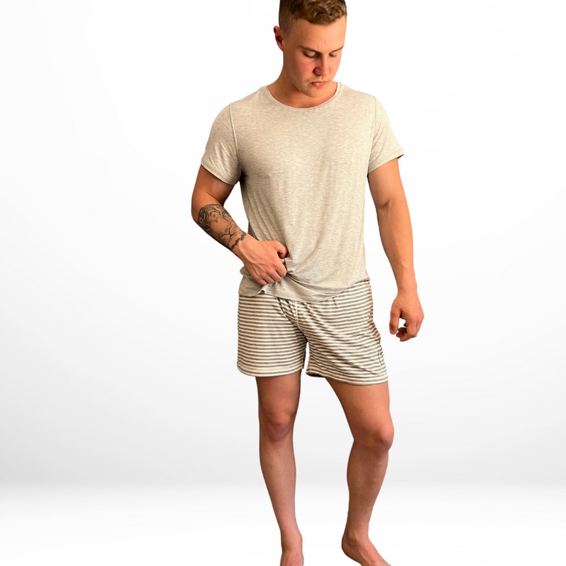 Standing guy wearing the grey stripe short  - the bamboo short pyjamas from Comfort on the Spectrum.
