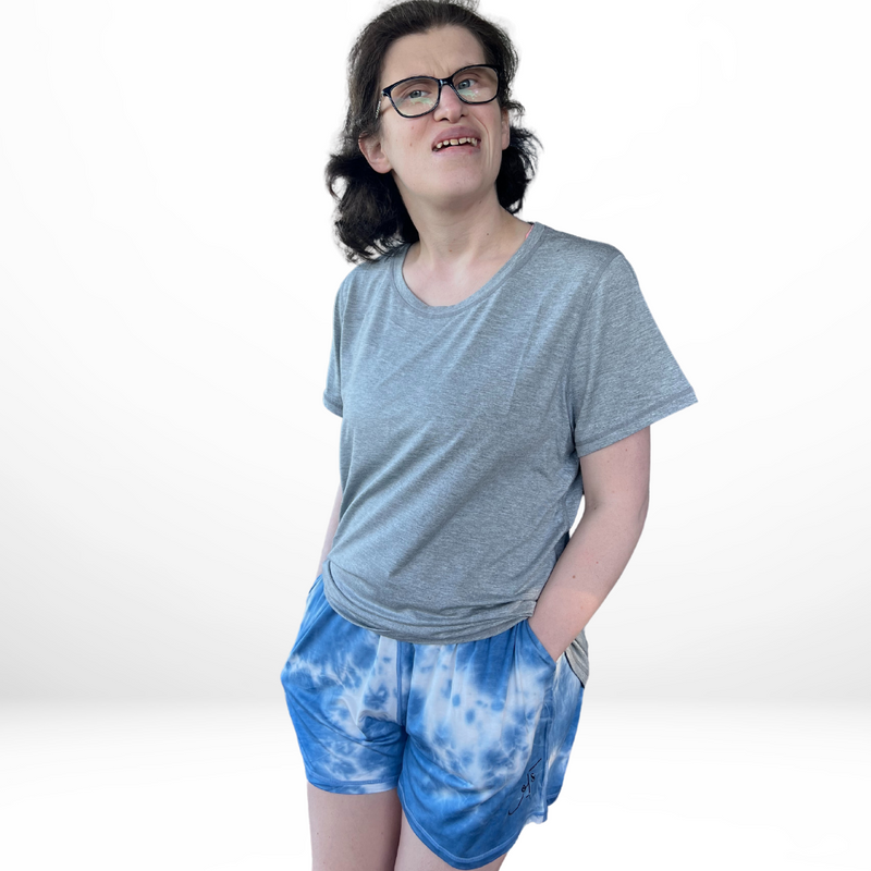 Standing woman wearing the sea breeze short  - the bamboo short pyjamas from Comfort on the Spectrum.