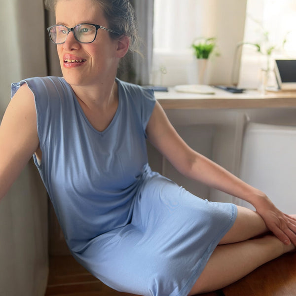 A lady wearing the blueberry breeze sleeveless nighties in Australia from Comfort on the Spectrum.
