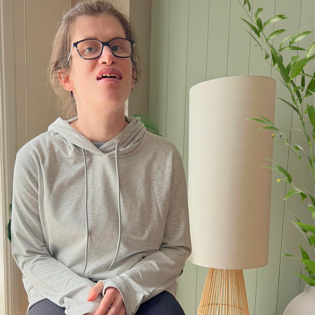 A women wearing the grey marle sensory hoodie from Comfort on the Spectrum.