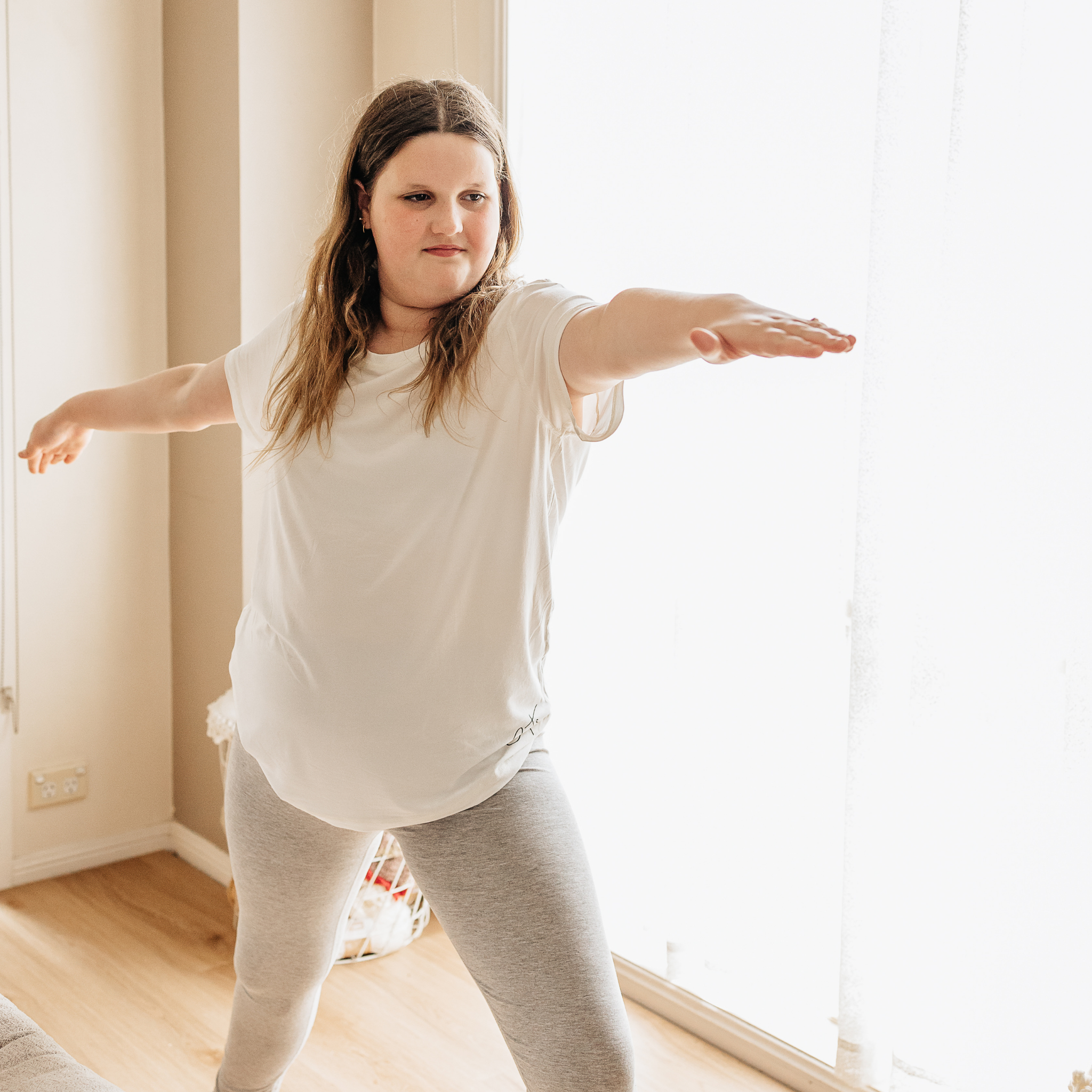 White bamboo t shirt and grey marle leggings from Comfort on the Spectrum  were worn by a lady.