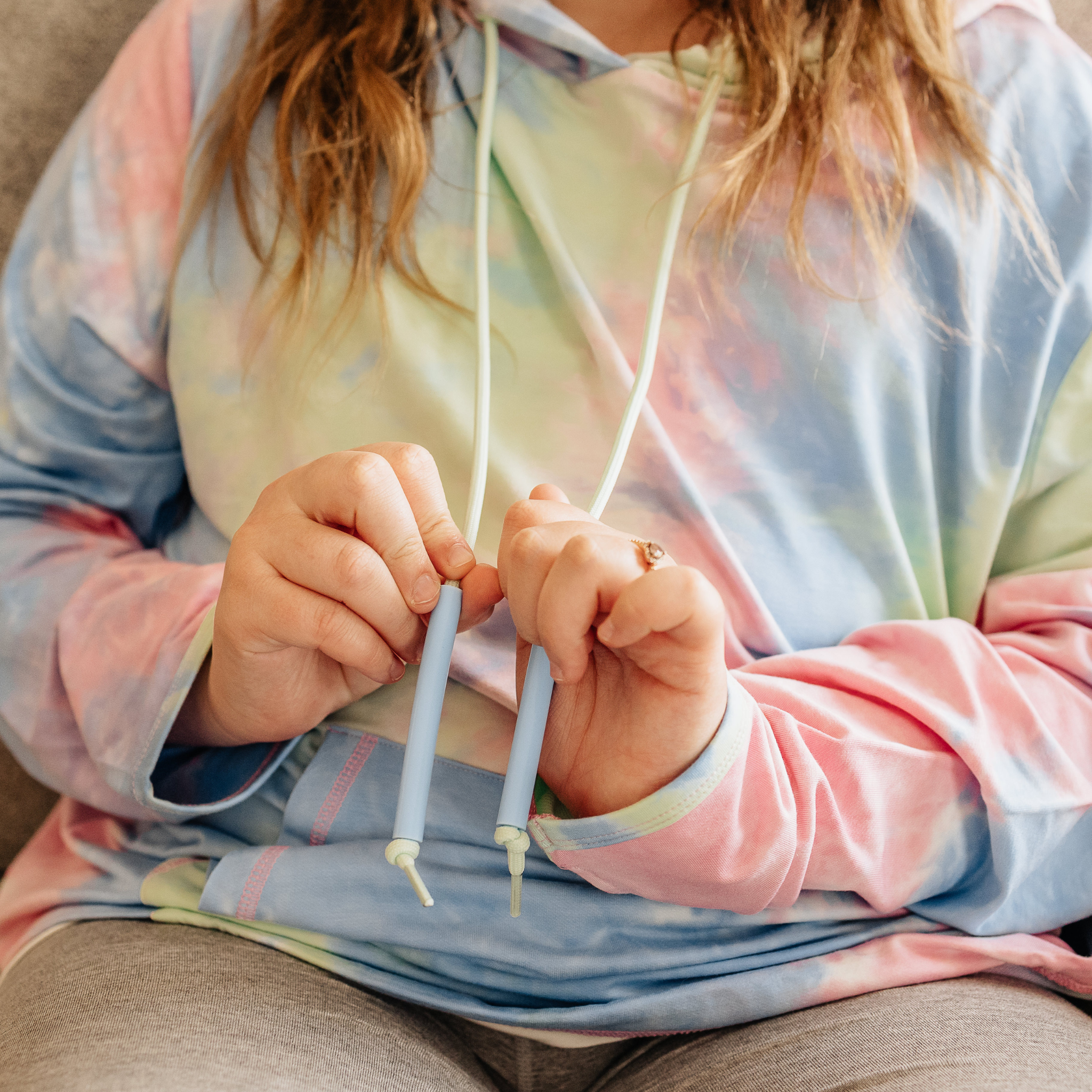 Adult wearing a soft, sensory-friendly hoodie designed for comfort and ease of movement.