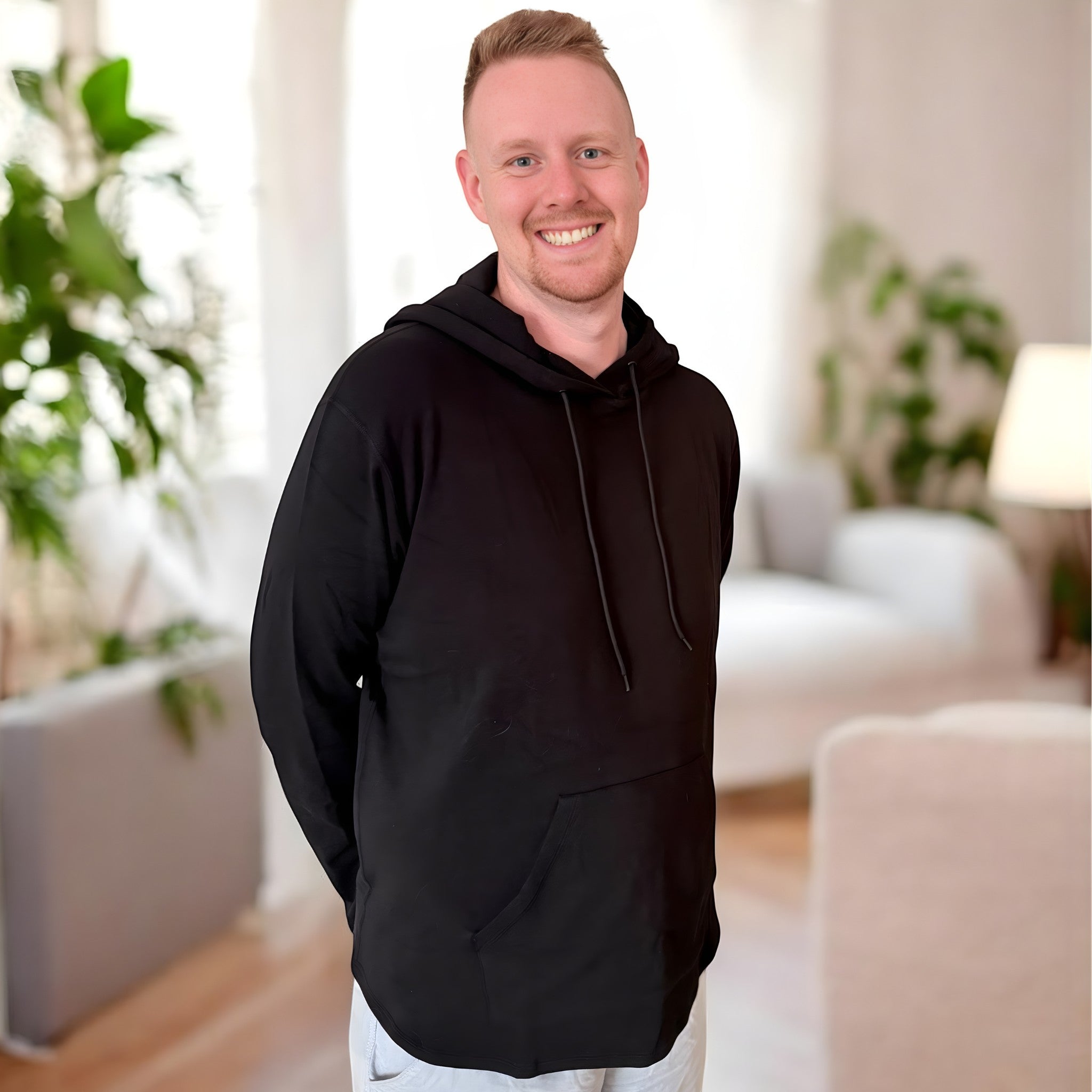 Comfort on the Spectrum Adult Sensory-Friendly Hoodie in black, made from bamboo-cotton blend with oversized hood and pouch pocket.