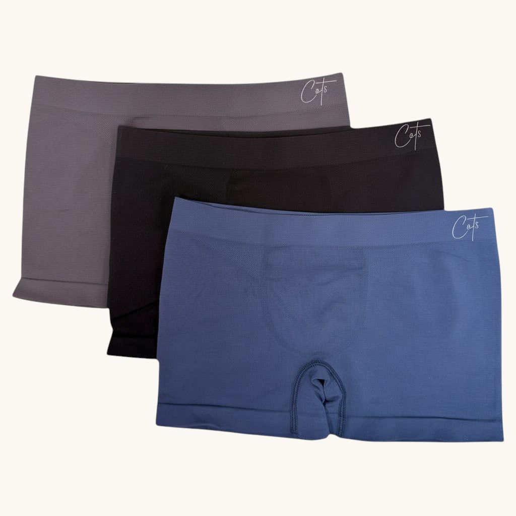 Comfort on the Spectrum Kids SkinSense™ Seamless Boxer Briefs in grey, black, and blue. Made from soft, breathable Lenzing™ Modal fabric.