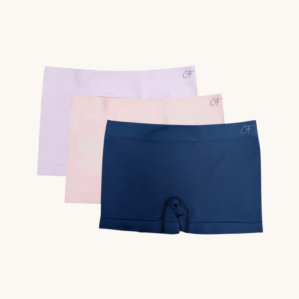Comfort on the Spectrum Kids SkinSense™ seamless shorty briefs in petal, lilac, and ink. Made from soft, breathable Lenzing™ Modal fabric.