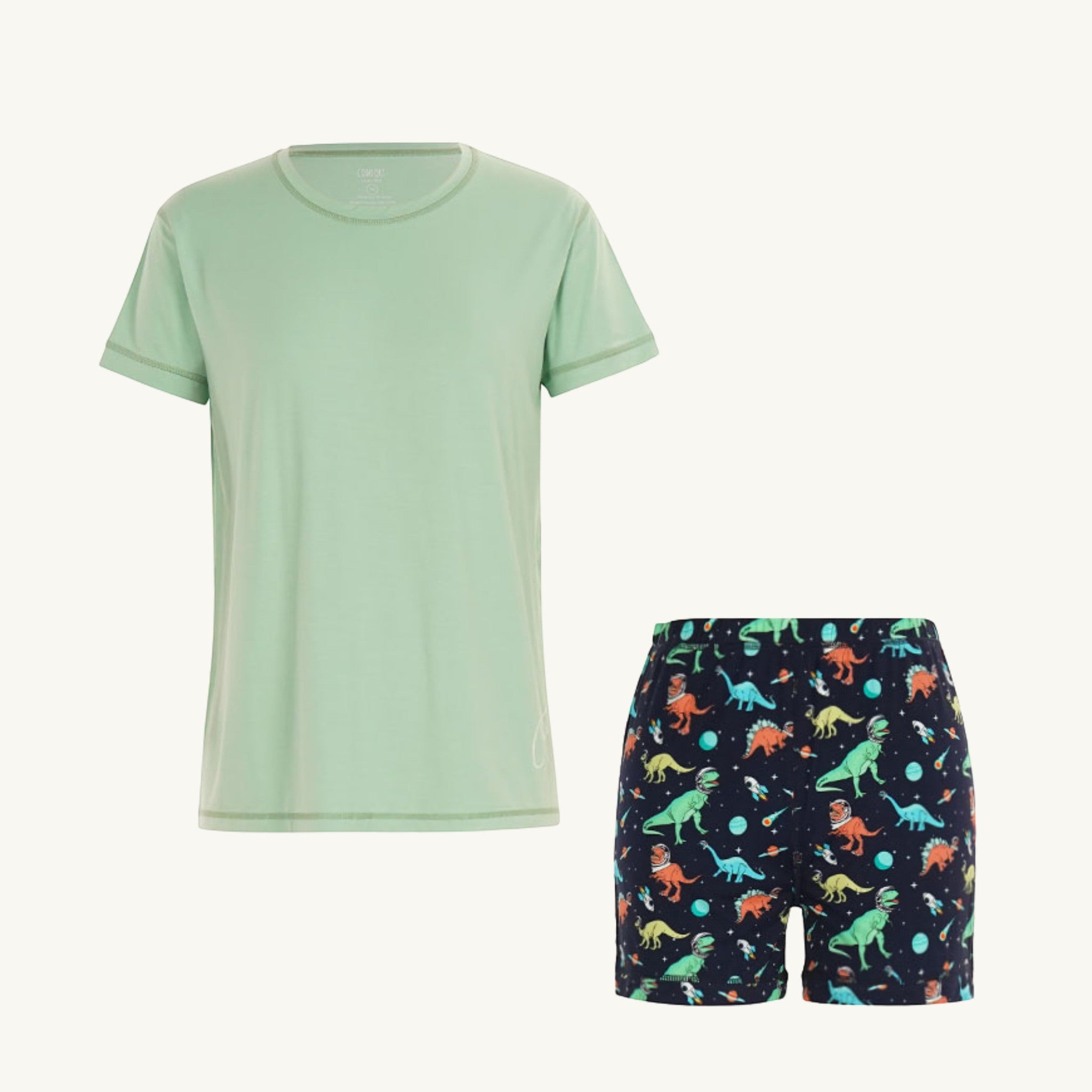 Comfort on the Spectrum kids short set: light green bamboo tee with space dinosaur print navy shorts. Sensory-friendly.