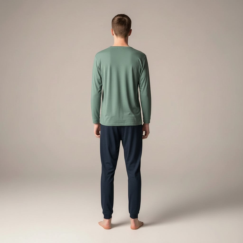 Comfort on the Spectrum navy bamboo lounge pants with tapered leg and pockets, worn by a man.