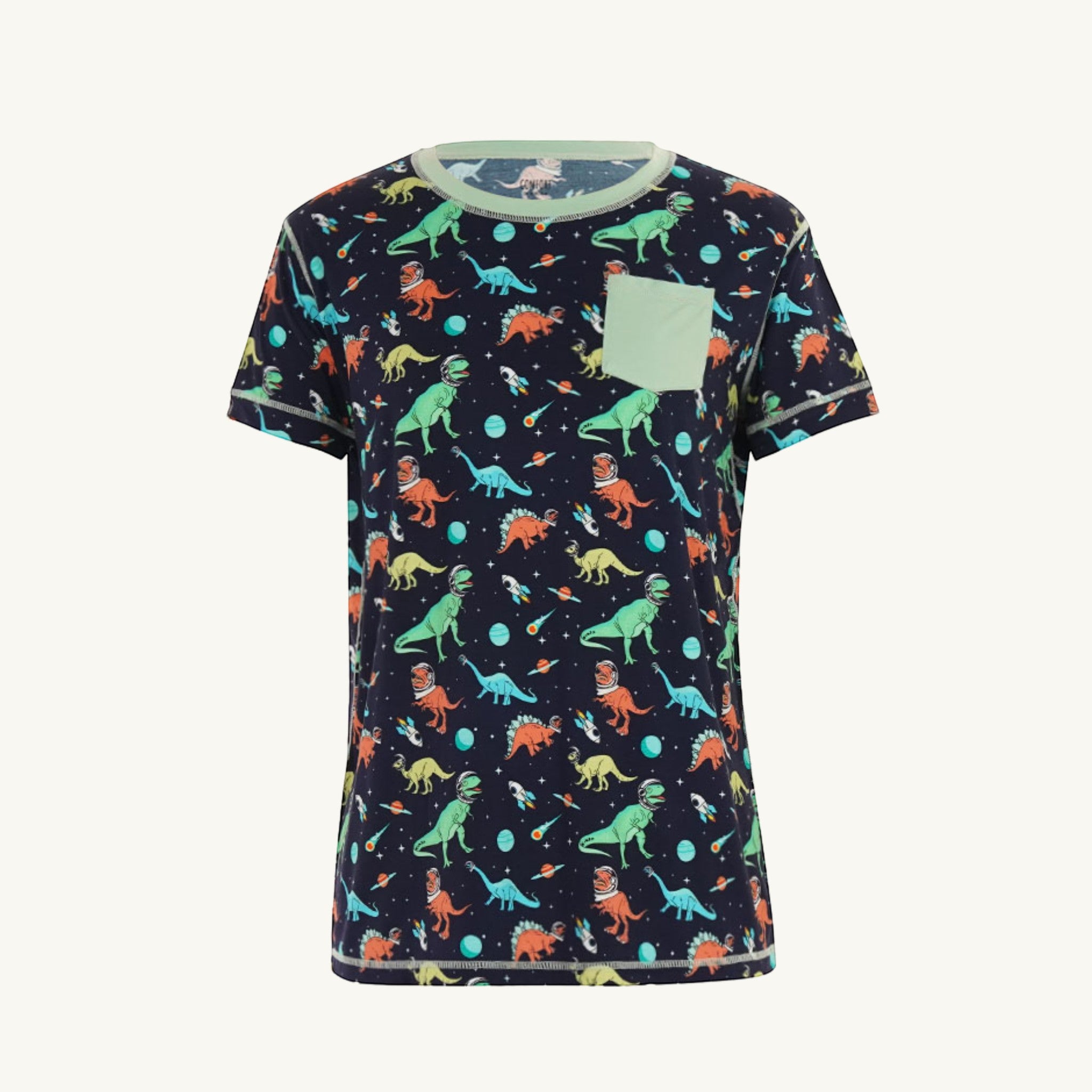 Comfort on the Spectrum navy t-shirt with space dinosaurs print, light green pocket, and mint trim.