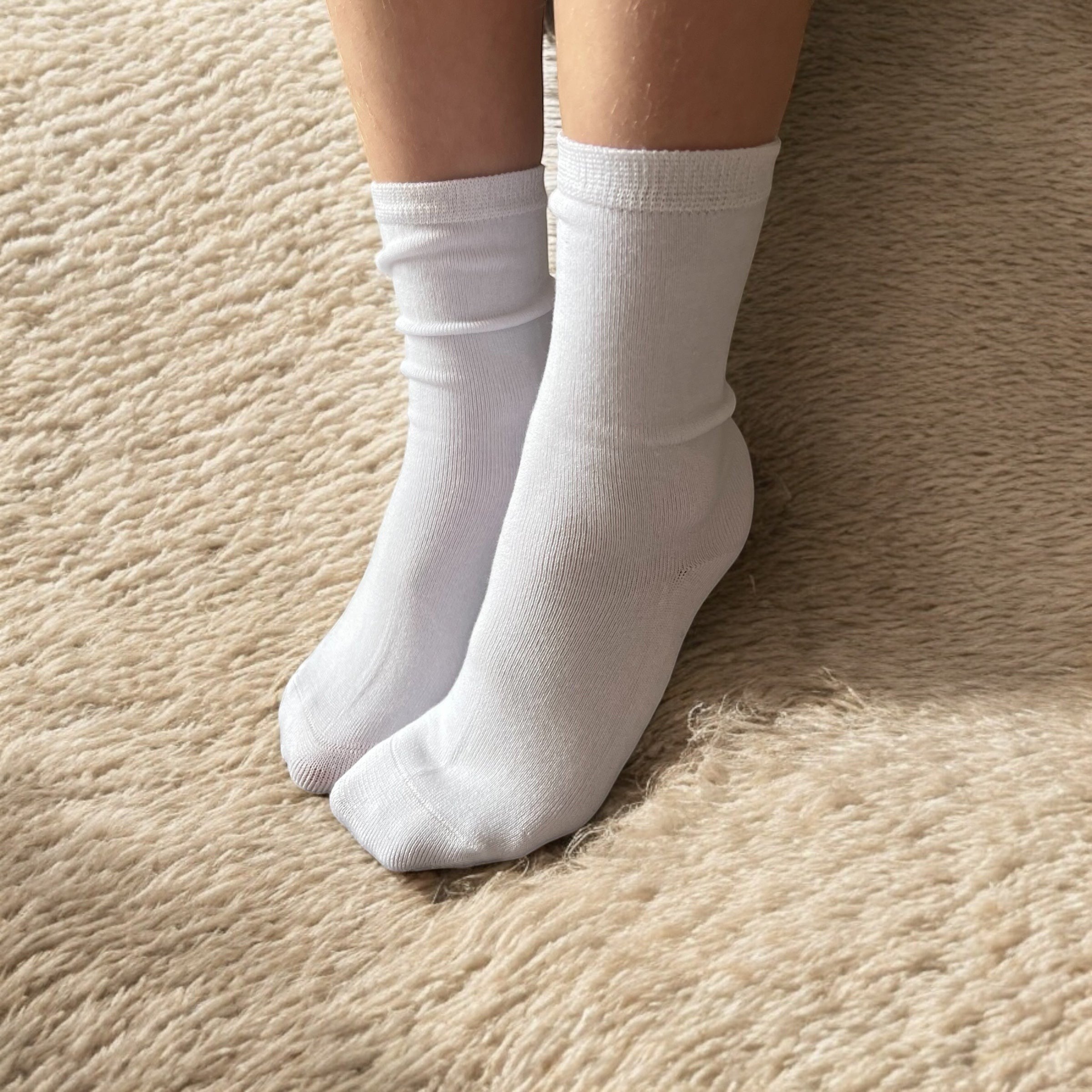 Comfort on the Spectrum white seamless sensory socks for kids, made from a bamboo/cotton blend with a hand-linked toe seam.