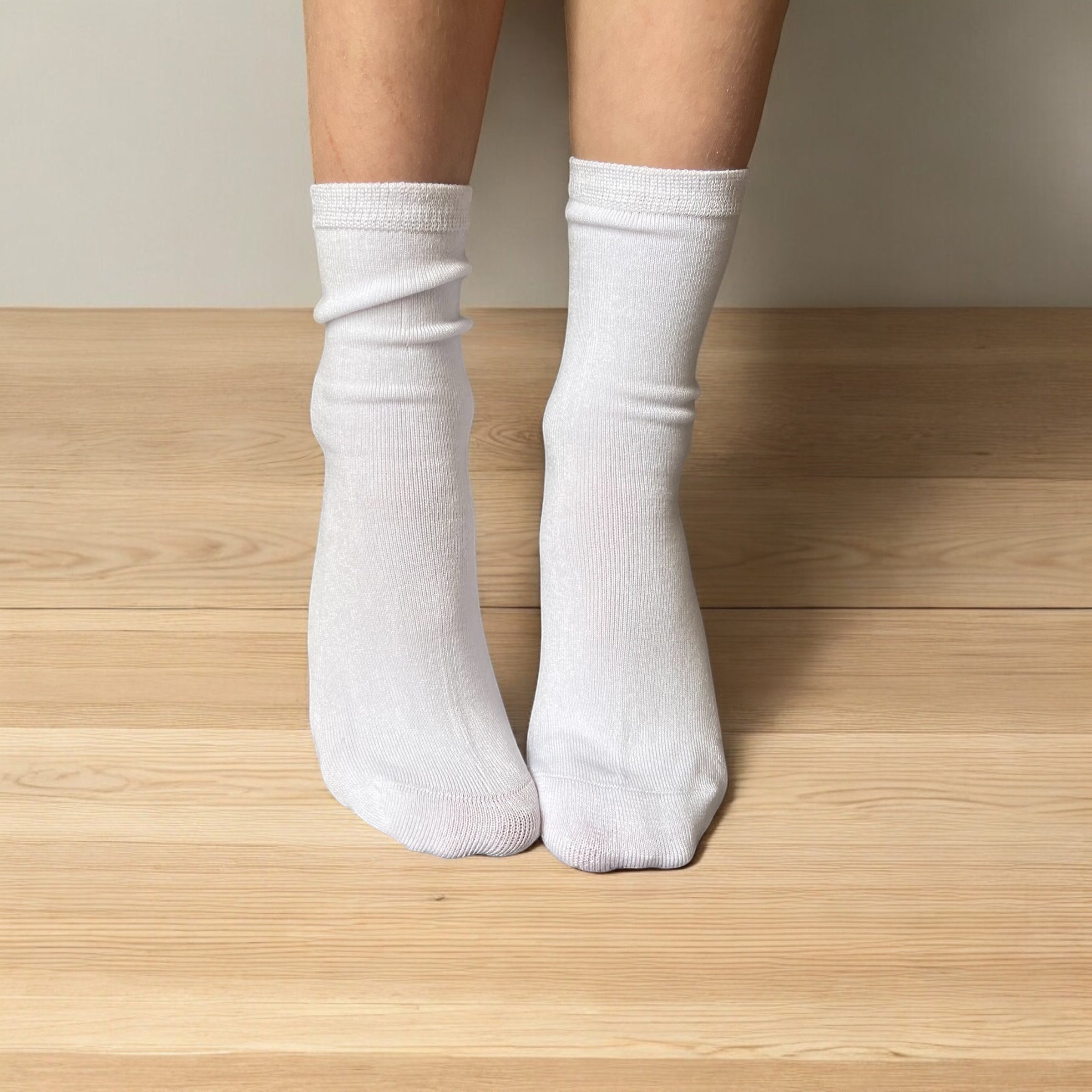 Comfort on the Spectrum white seamless sensory socks for kids, made from a bamboo/cotton blend with a hand-linked toe seam.