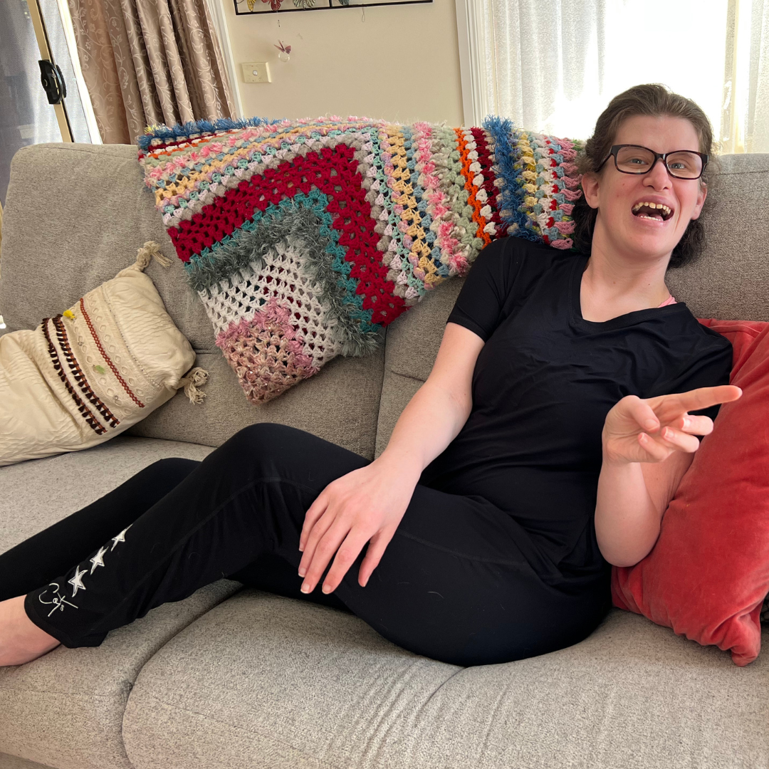 Woman wearing sensory friendly pajamas for adults in soft bamboo fabric - midnight jumpsuit from Comfort on the Spectrum.